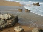 Waves breaking over berm 3
